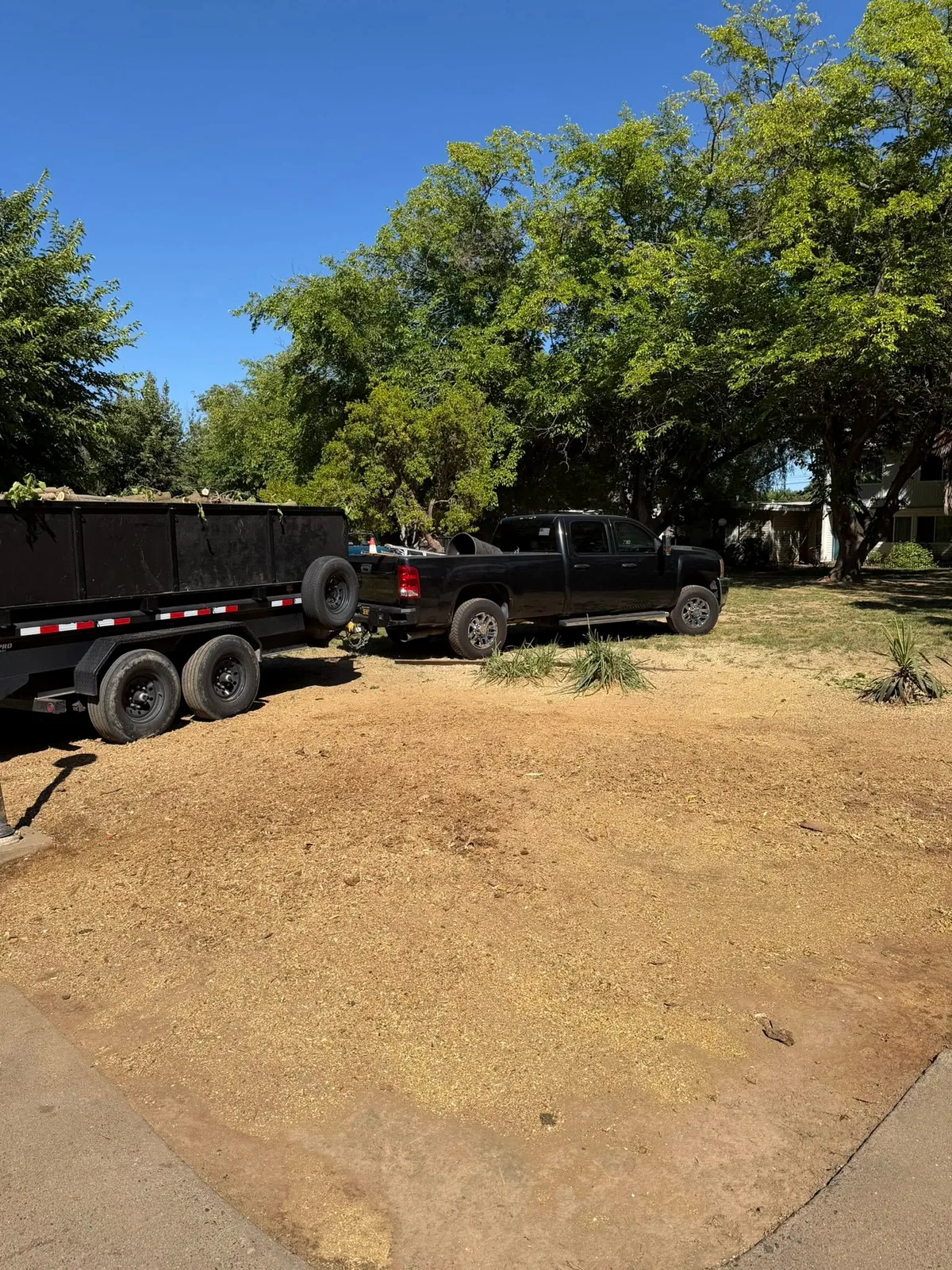 Tree to Stump truck and debris trailer at a work site